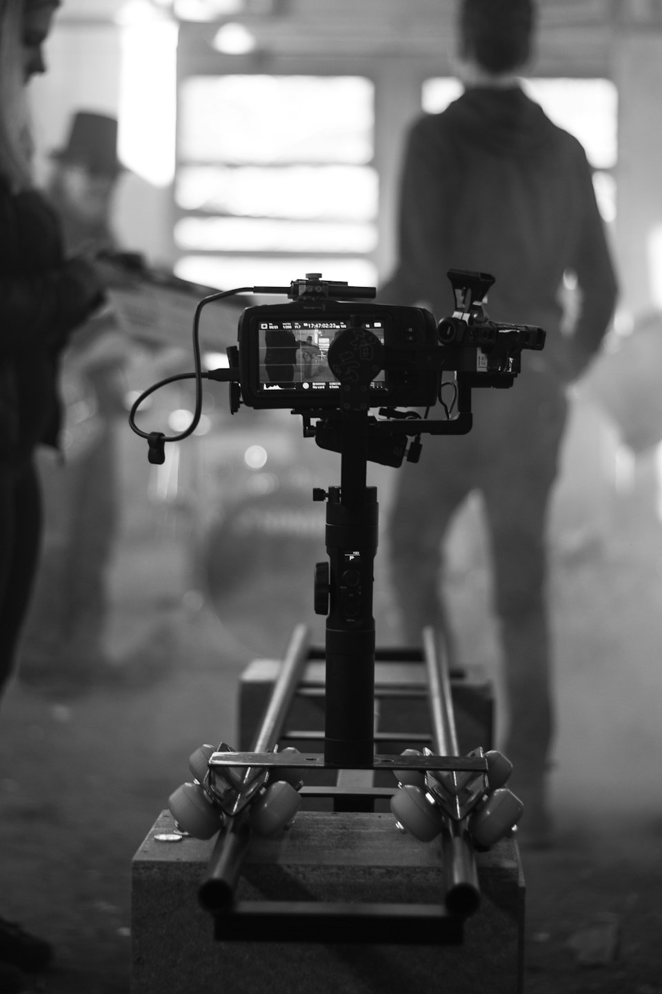Video camera rig on a dolly in a studio.
