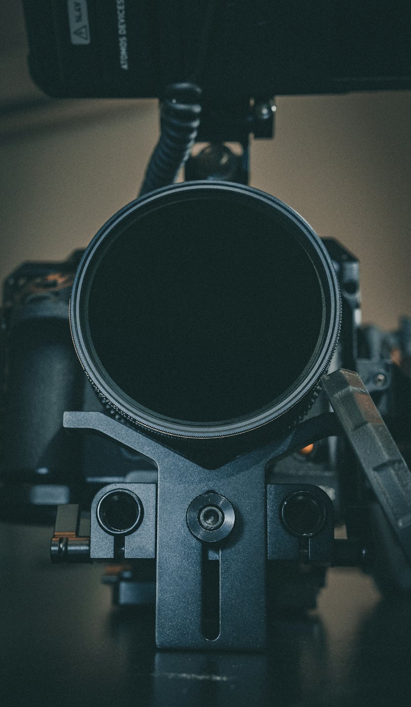 Professional camera lens filter mounted on a metal rig.
